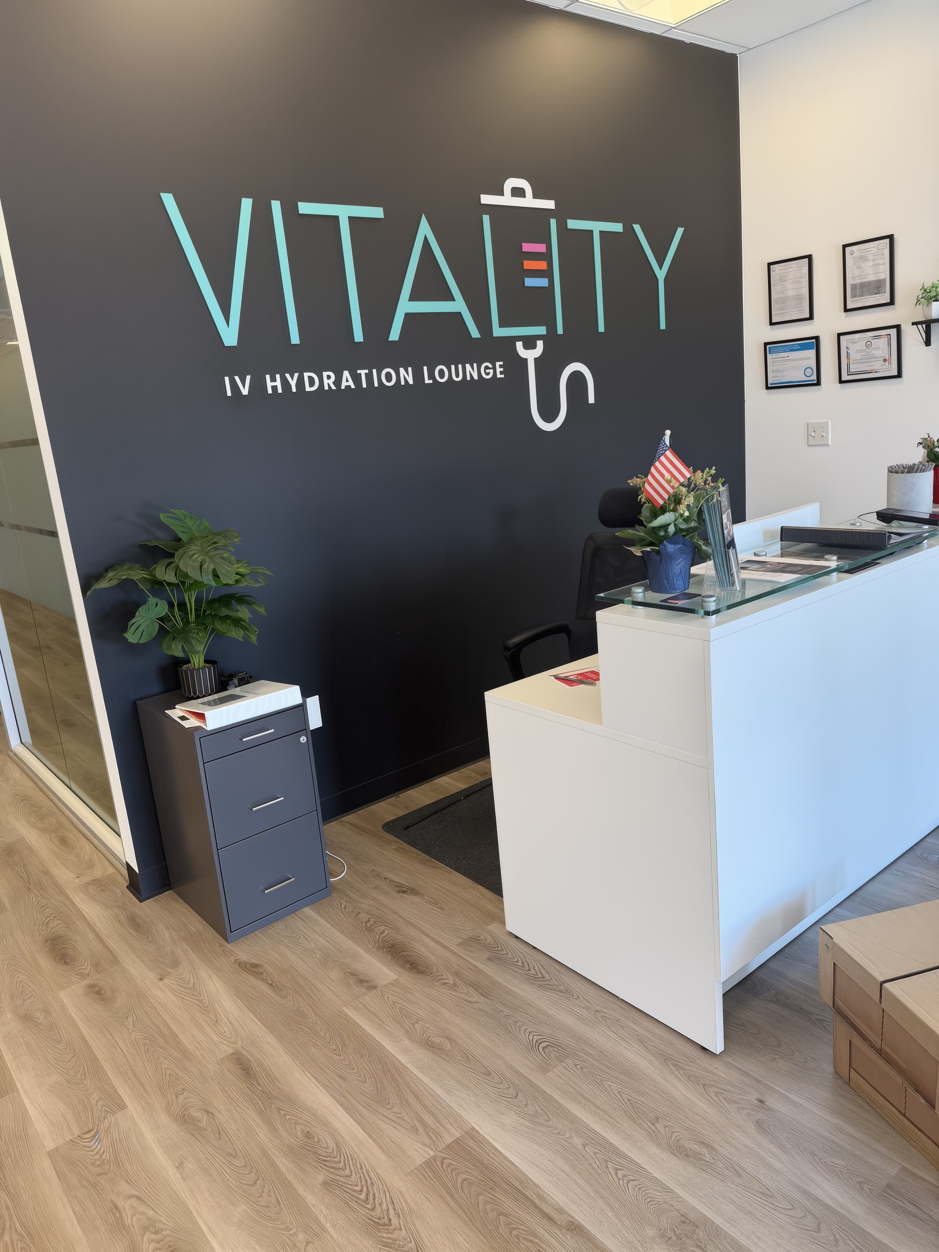 Vitality IV Hydration reception and logo wall