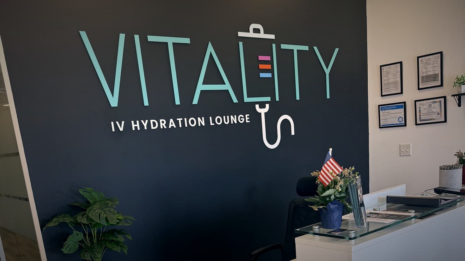 Vitality IV Hydration reception, logo wall, and credentials