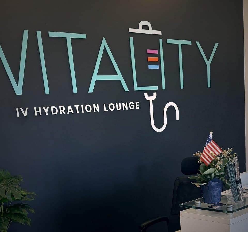 Vitality IV Hydration reception, logo wall, and credentials